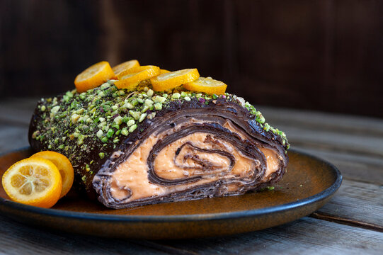 Trendy Shrovetide roll of chocolade  thin pancakes with cream
