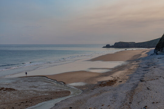 Wide empty beach with gentle waves