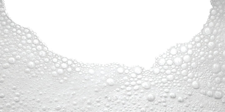 A close-up view of soap suds or foam bubbles forming a textured wave on a white background