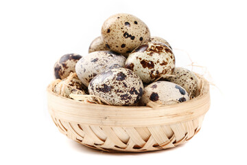 Obraz premium Fresh Quail Eggs in Wicker Basket - Healthy Protein Rich Farm Delicacy on White Background