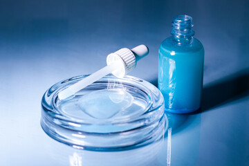 Blue Copper peptides skin repairing serum in transparent bottle. Face and skin beauty routine themes