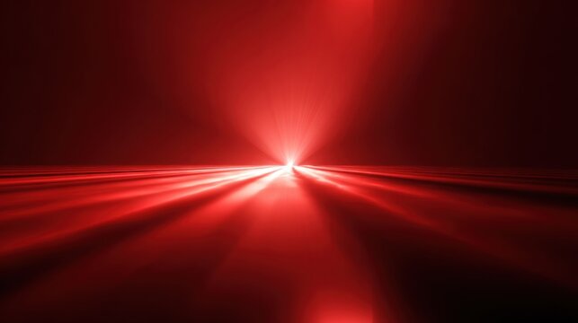 Bright red light beams radiate outward, creating a striking visual effect in a dimly lit environment. The intense glow forms a captivating pathway that draws the eye.