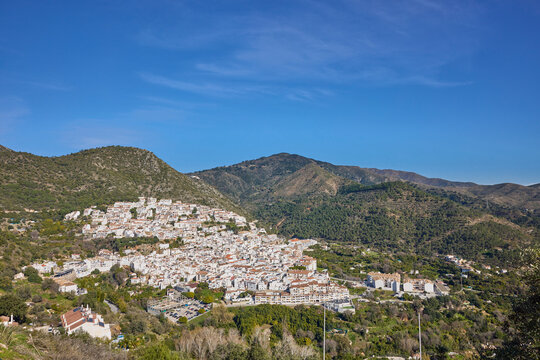 Ojen white town nestled in spanish mountains