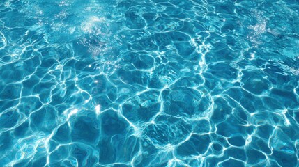 Obraz premium Sunlight dances on the surface of a crystal-clear pool, showcasing vibrant turquoise hues. Gentle ripples create mesmerizing patterns, inviting relaxation.