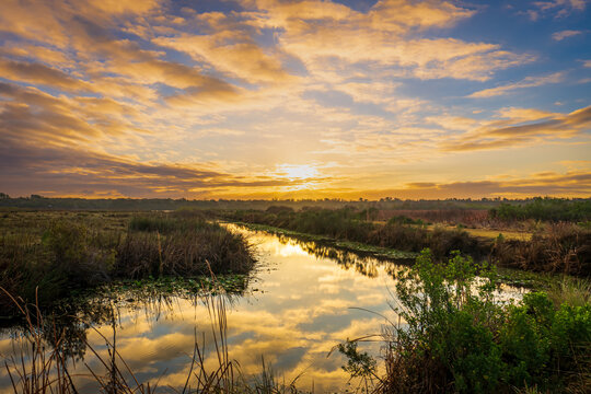 Sunrise and clouds over Lake Woodruff National Wildlife Refuge in Florida
