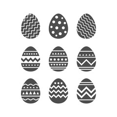 Minimalist monochrome vector illustration in stencil cutout style. Flat geometric Easter egg icons with bold silhouettes and decorative stripe, zigzag, dot and wave patterns. High contrast black shape
