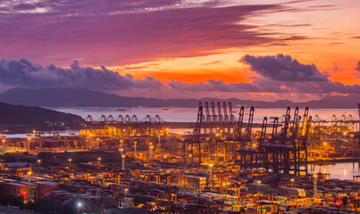 Fototapeta premium Shenzhen Harbor Sunset with Container Cranes and Cargo Port