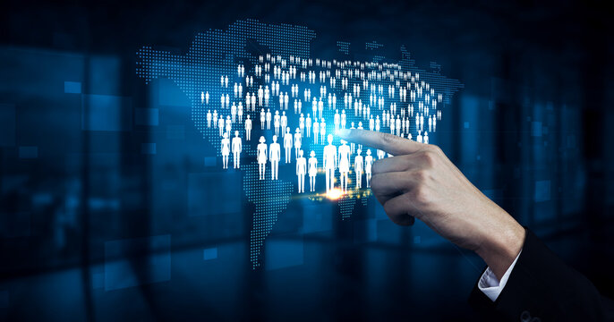 Business concept of digital connectivity with hand pointing at virtual global audience of users on a world map background in a high-tech environment Quark.