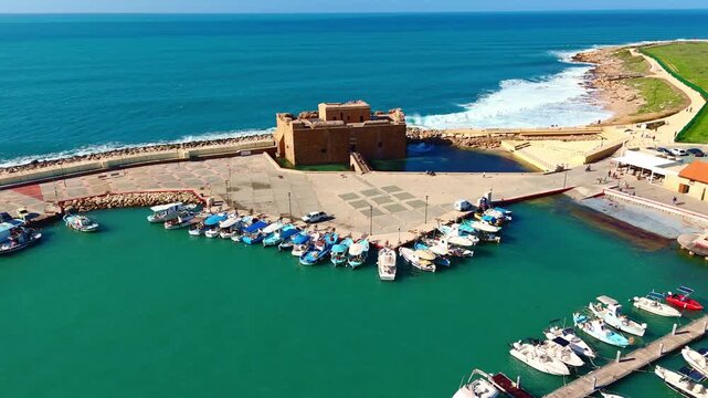 Aerial view of Paphos Medieval Castle and harbor with boats at sunny day in Cyprus, 4K