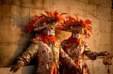 Venice, Italy - February 07, 2026: Two elaborately dressed individuals in ornate costumes with...