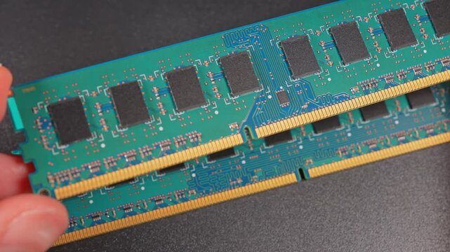 Computer RAM or Random Access Memory, chips on the board, increasing price concept. DDR RAM memory cards are used for AI data centers. Supply chain tightening due AI boom and high demand AI clients.
