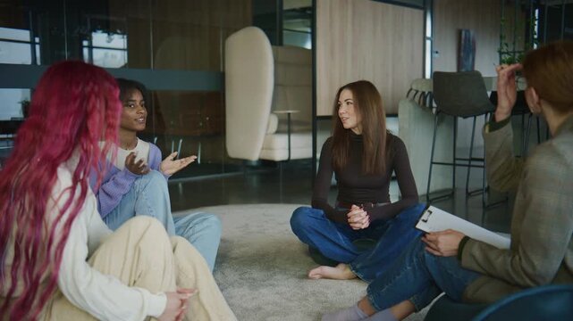 Women participate in a psychology session focused on mental health and personal growth in a modern office setting during the daytime
