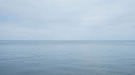 Fototapeta premium Calm Ocean Horizon Under Clear Daylight Sky