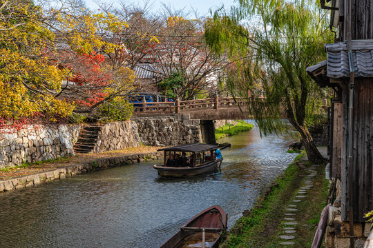 Scenic sight of Hachiman-bori canal in Omihachiman during fall season. Kansai region, Shiga Prefecture, Japan.