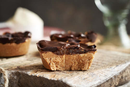 Closeup of homemade snacks made with whey protein powder, oat flakes, maple syrup and peanut butter