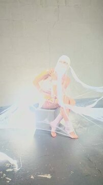 Woman in Mummy Costume Laughs During Photoshoot