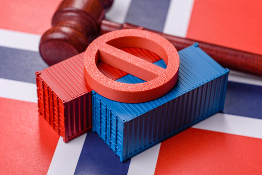 The cargo container ban on the Norwegian flag as a conceptual backdrop. The cargo container embargo