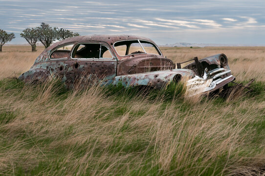 Old Rusted Car Riddled with Bullet Holes in South Dakota Badlands
