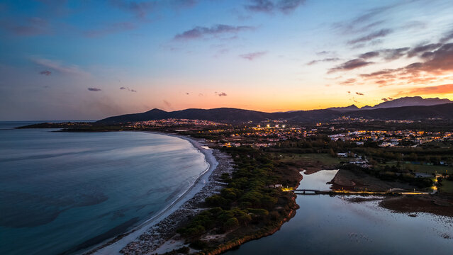Aerial twilight view of Budoni beach and Stagno Morto lagoon, Sardinia, Italy.