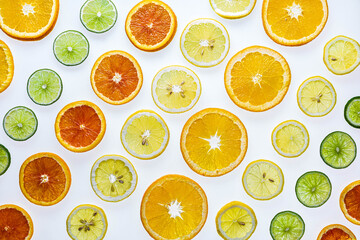 Rows of sliced lemons, limes, navel and cara cara oranges.