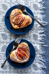 Heart shaped peach and cream cheese filled pastries, ready for eating.