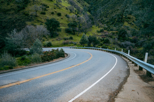 Sharp curve on a rural mountain road through the California foothills