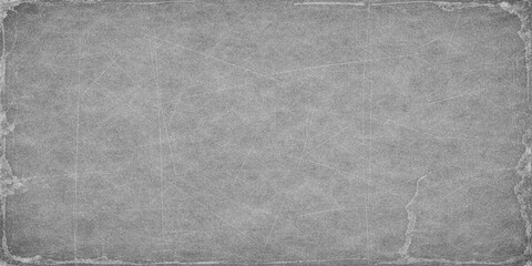 Old paper texture and vintage black and white chalk board design on a dark grunge canvas with a rough grey concrete wall pattern for a textured backdrop surface © RASEL