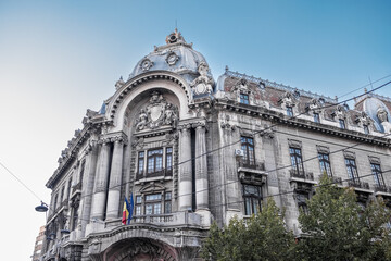 Fototapeta premium The Romanian flag flies proudly outside the National Bank of Romania