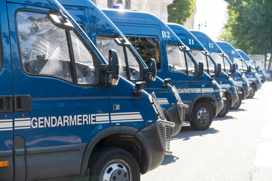France, Paris.  A row of police vehicles.