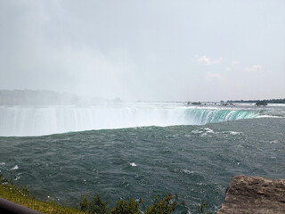 Massive Waterfall Edge with Turquoise Water and Mist, Powerful Natural Landscape Background