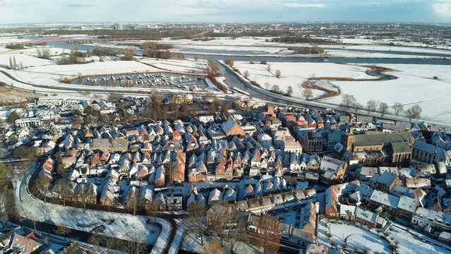 Hattem, the Netherlands - January 4th 2026: Aerial photo of a snowy medieval city center during winter time. 