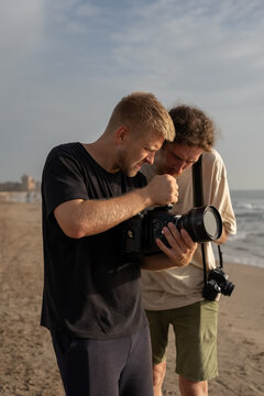 Videographer discussing video with colleague