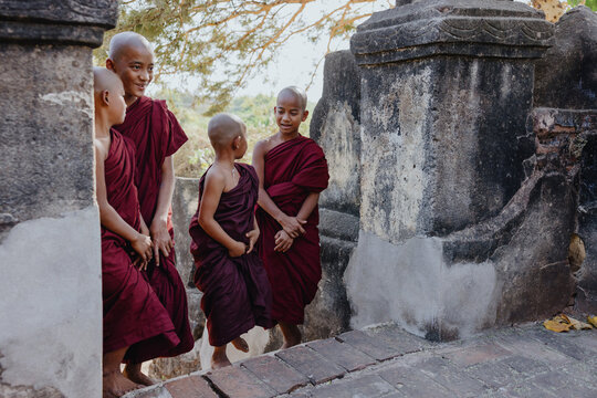 Monks conversing in ancient temple ruins