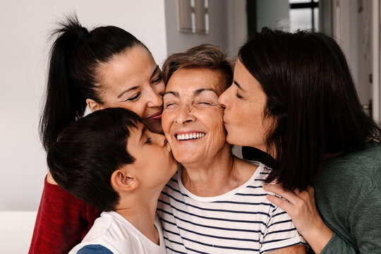 Multi-generational family sharing affectionate moment