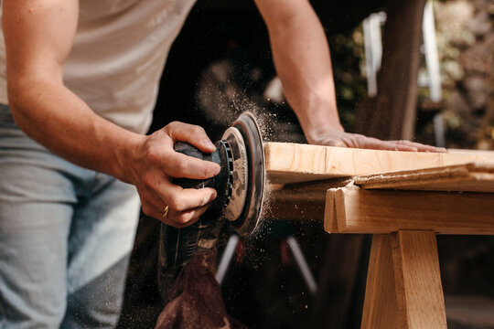 Carpenter sanding wood