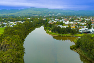 Fototapeta premium Drone aerial photograph of Towradgi Creek in the coastal town of East Corrimal located north of Wollongong in the Illawarra region of New South Wales, Australia.