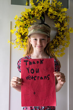 Young Girl with card portrait thanking veterans tribute 