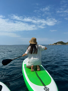 Woman sup sea
