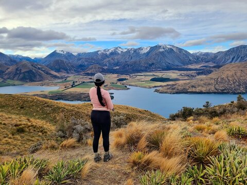 staring at the view of lake and mountains.