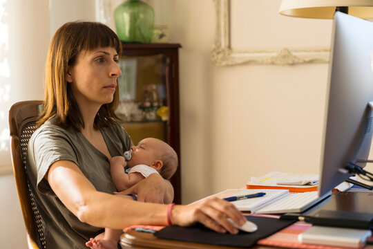 Mother at the computer with her baby