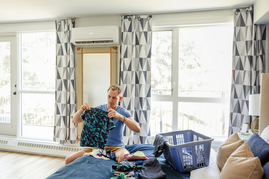 Father Folds Laundry