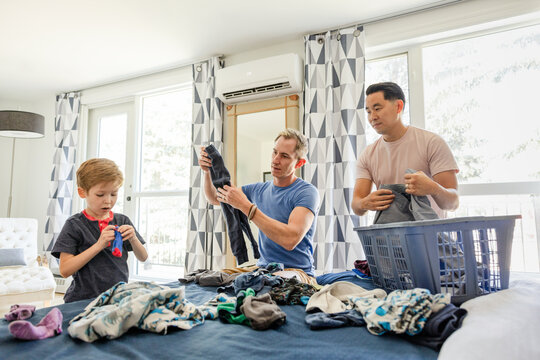 Son Helps His Dad With Laundry