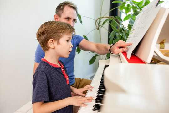 Father Teaching Son Piano