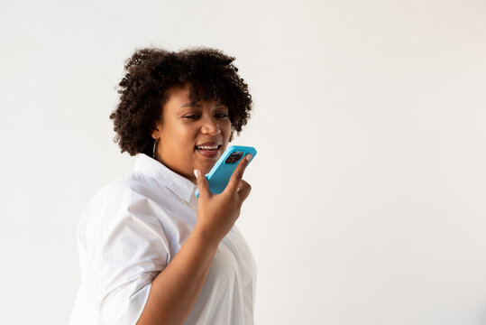 Woman Recording Voice Message On Smartphone