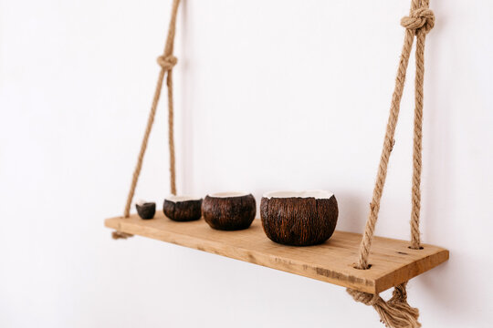 Decorative bowls on wall hanging shelf