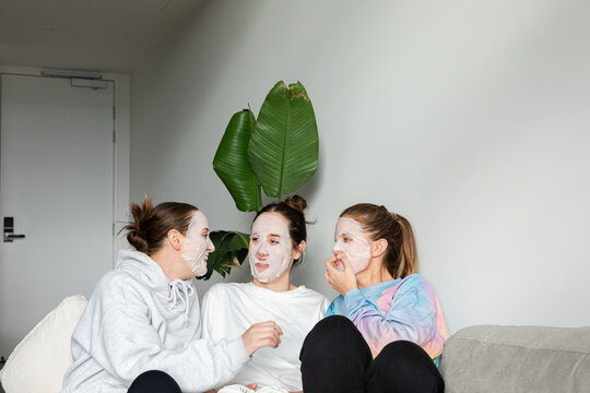 Three friends enjoy a face mask spa day in an apartment in Melbourne