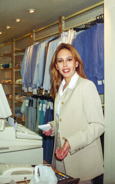 35 mm analog photo of woman at checkout in clothing store
