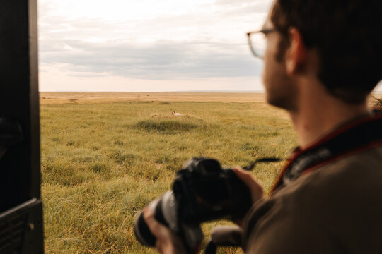 Person taking a photo in Kenya on safari