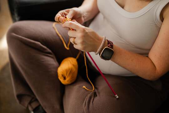 Pregnant woman knitting