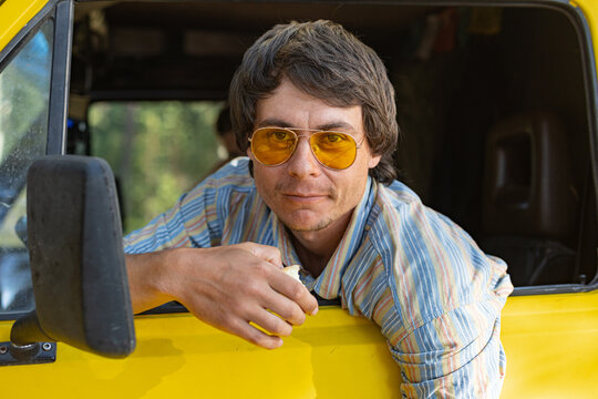 Stylish Young Driver Portrait At The Wheel